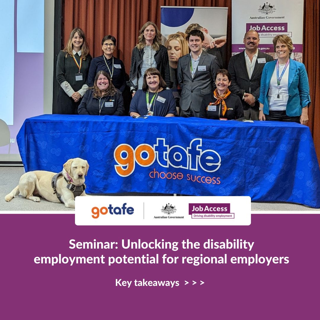 Picture of speakers, JobAccess and GOTAFE staff on a stage with an assistance dog