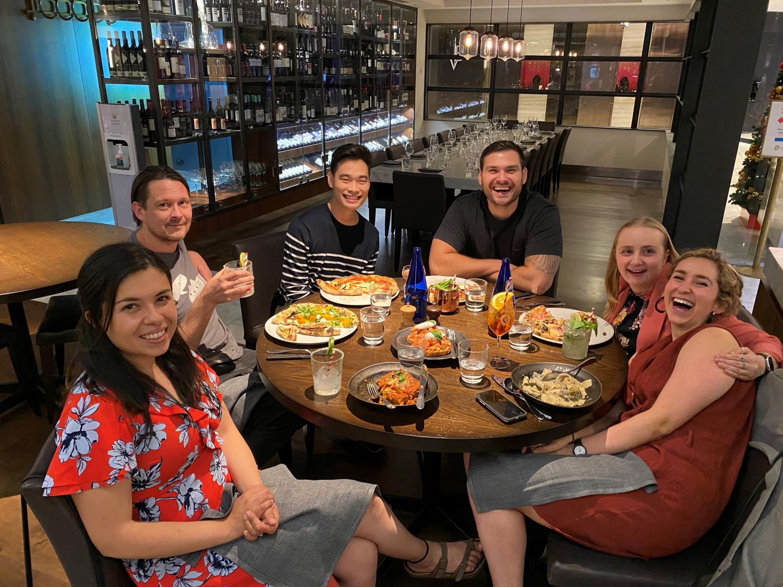 Cassandra Embling (2nd from right) and Mladen Jovanovic (3rd from right) at an end-of-year dinner with BindiMaps' team members (Source: BindiMaps)