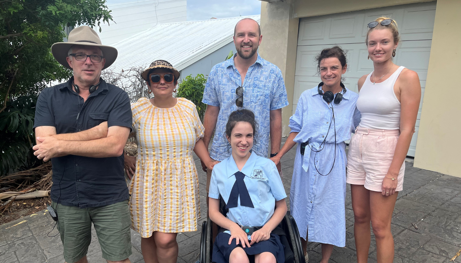 Still from the production set of ‘Audrey’. There are four women and two men in the picture. From left to right: Michael Wrenn (producer, Audrey), Lou Sanz (writer, Audrey), Hannah Diviney (actor), Zach Nielsen (CEO, Ascend Health Group), Natalie Bailey (director, Audrey), and Sasha Henstock (physiotherapist and carer, Ascend Health Group) 