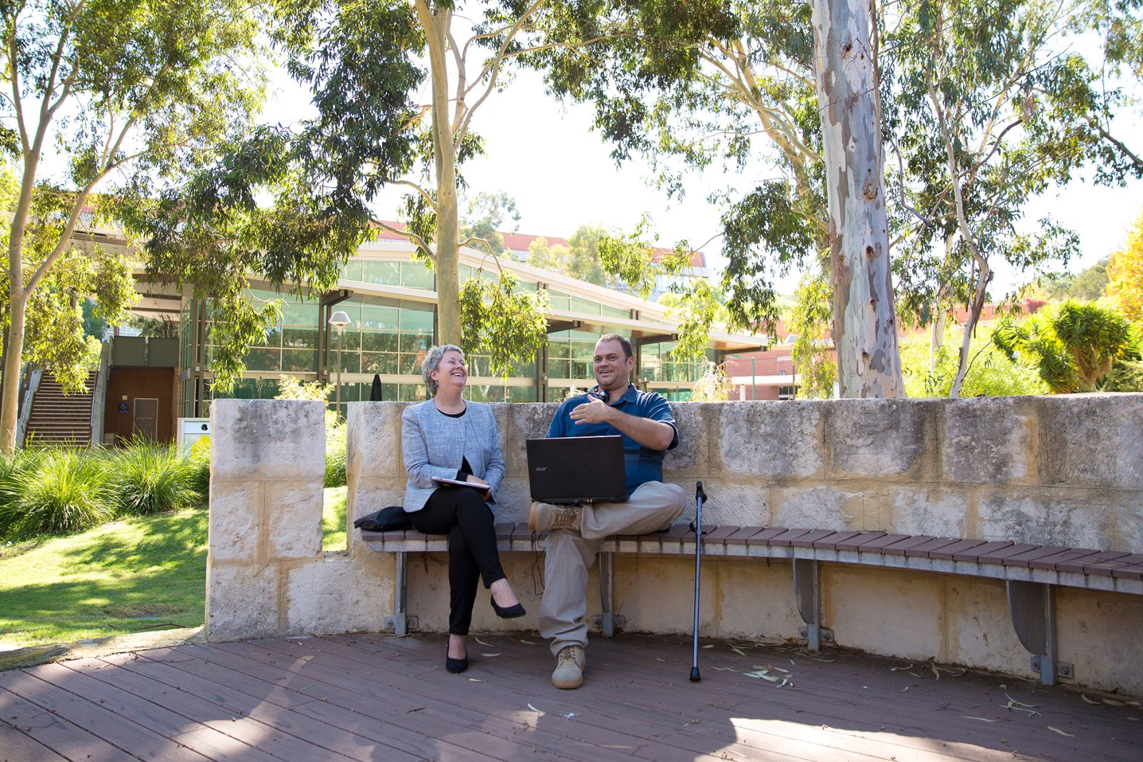 Man (with walking stick) and woman in a discussion (Source: Curtin University)